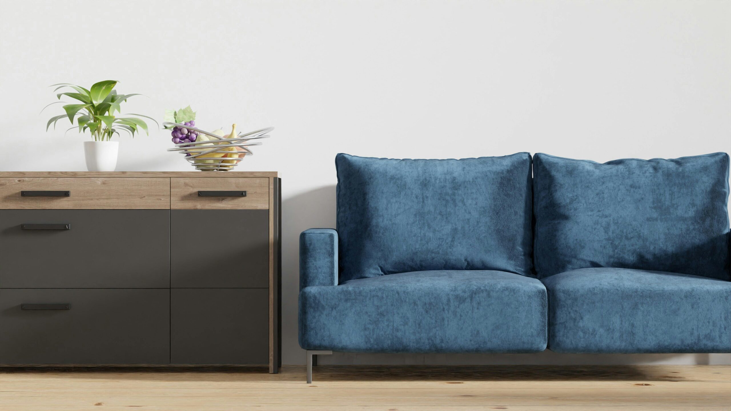 Stylish minimalist living room featuring a blue sofa and wooden cabinet.